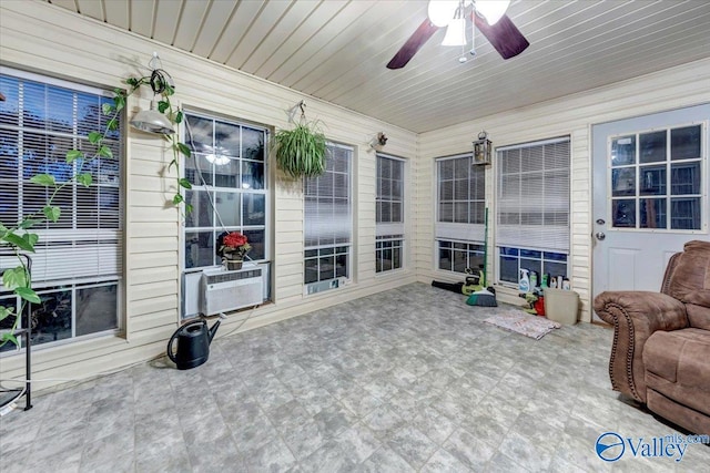 sunroom featuring cooling unit, wood ceiling, and ceiling fan