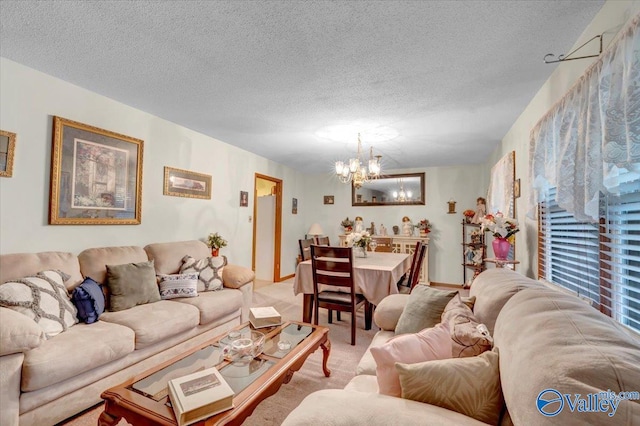 carpeted living room featuring a textured ceiling and a notable chandelier