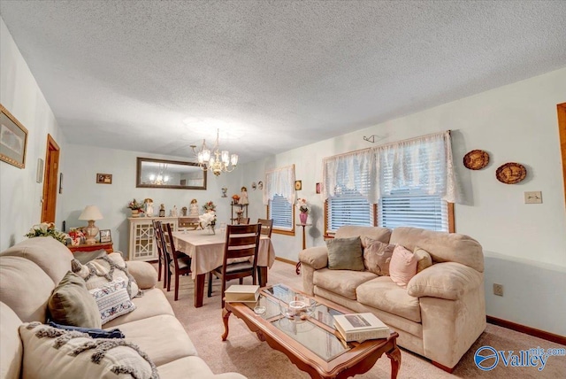 carpeted living room featuring a chandelier and a textured ceiling