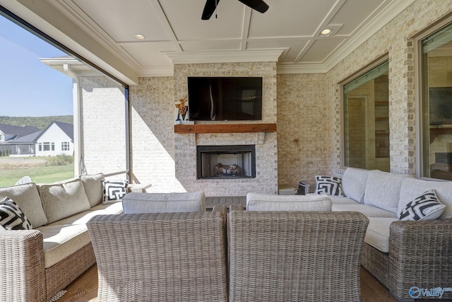view of patio / terrace featuring a ceiling fan and an outdoor living space with a fireplace