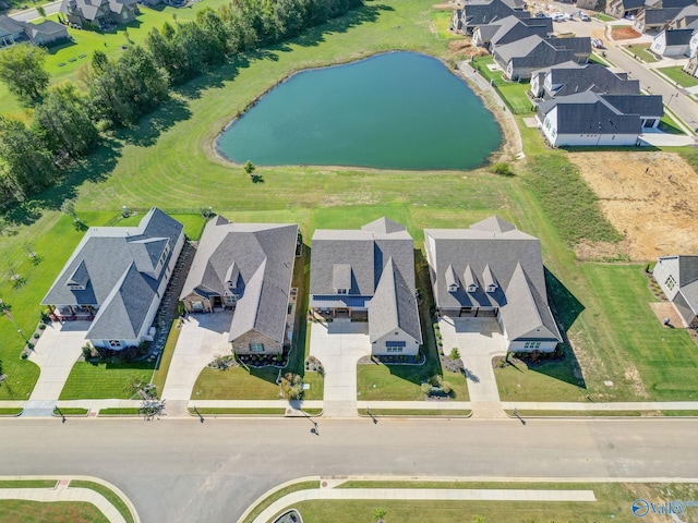 birds eye view of property featuring a water view and a residential view