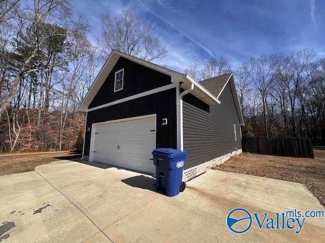 view of side of property with a garage