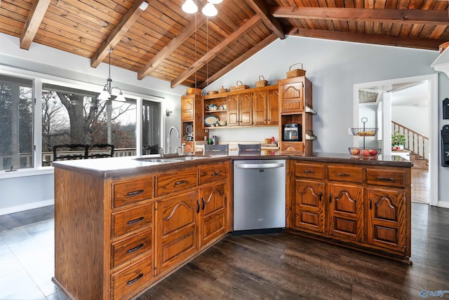 kitchen featuring brown cabinetry, dark countertops, stainless steel dishwasher, open shelves, and a sink