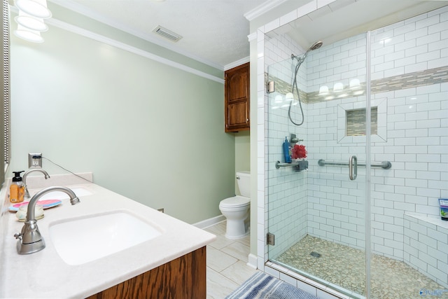 full bathroom with crown molding, double vanity, visible vents, toilet, and a sink