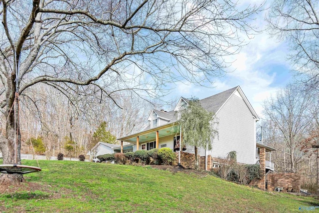 view of home's exterior with a lawn