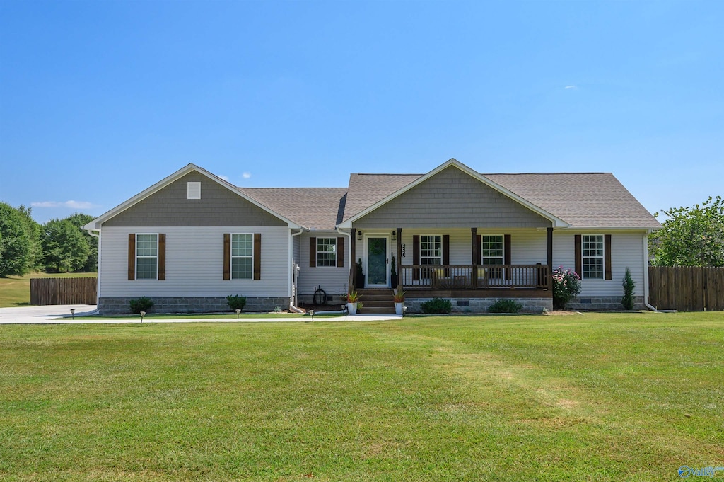 single story home featuring a front lawn