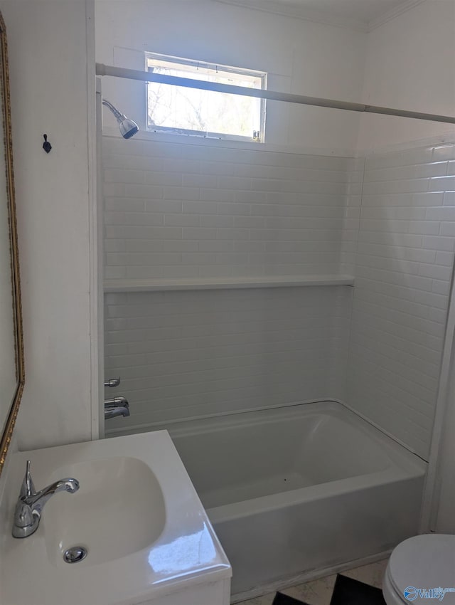 full bath with toilet, shower / tub combination, and a sink