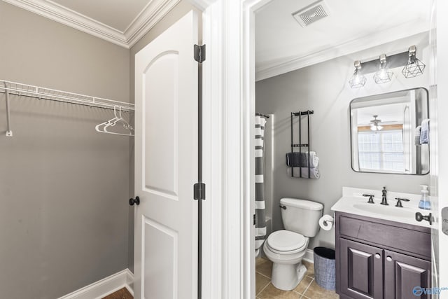 bathroom featuring tile patterned floors, ornamental molding, toilet, and vanity