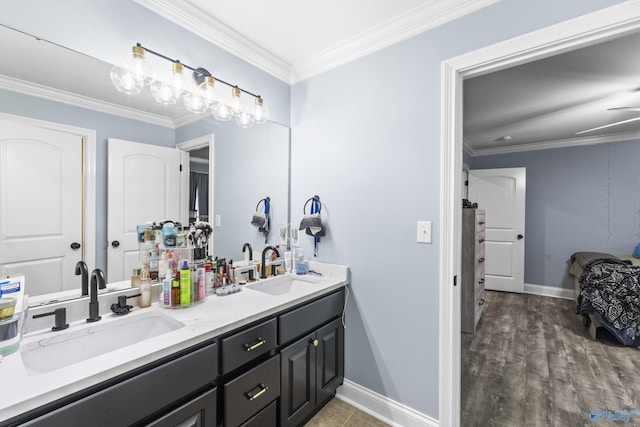 bathroom with vanity, hardwood / wood-style flooring, and ornamental molding