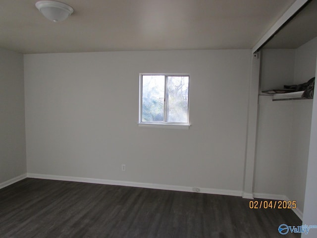 empty room featuring dark hardwood / wood-style floors