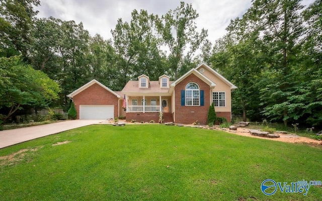 view of front facade featuring a porch, an attached garage, brick siding, driveway, and a front yard