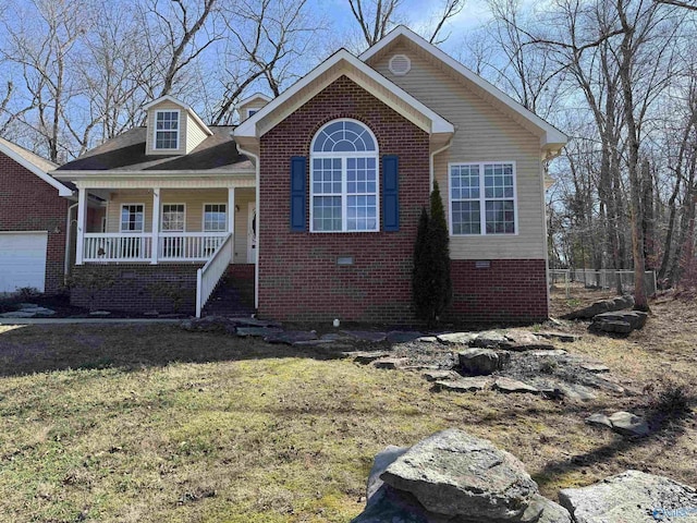 view of front of property featuring a porch, a front yard, crawl space, and brick siding