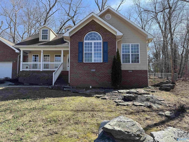 view of front facade featuring a porch, crawl space, brick siding, and a front lawn