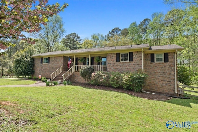 1762 Old Big Cove Rd SE, Owens Cross Roads, AL 35763 - ranch-style home featuring a front yard and brick siding
