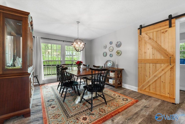 1762 Old Big Cove Rd SE, Owens Cross Roads, AL 35763 - dining room featuring a chandelier, a textured ceiling, wood finished floors, and baseboards
