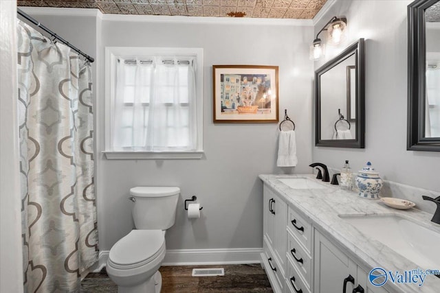 1762 Old Big Cove Rd SE, Owens Cross Roads, AL 35763 - full bathroom featuring baseboards, a sink, an ornate ceiling, and toilet
