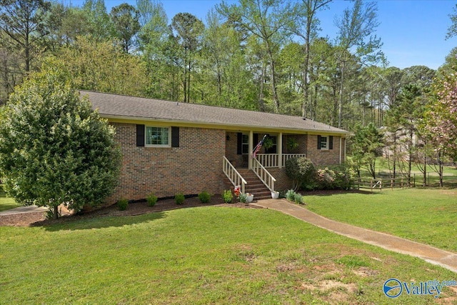 1762 Old Big Cove Rd SE, Owens Cross Roads, AL 35763 - ranch-style house with a porch, a front lawn, and brick siding