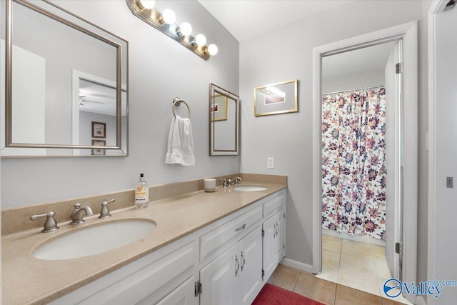 1762 Old Big Cove Rd SE, Owens Cross Roads, AL 35763 - full bathroom with tile patterned floors, double vanity, a sink, and baseboards