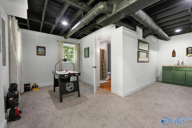 1762 Old Big Cove Rd SE, Owens Cross Roads, AL 35763 - recreation room with light colored carpet and baseboards