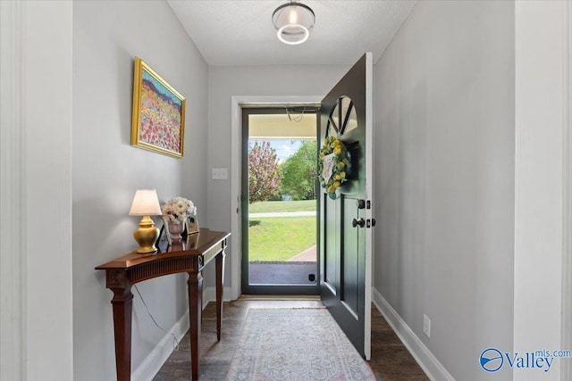 1762 Old Big Cove Rd SE, Owens Cross Roads, AL 35763 - entrance foyer featuring baseboards, a textured ceiling, and wood finished floors