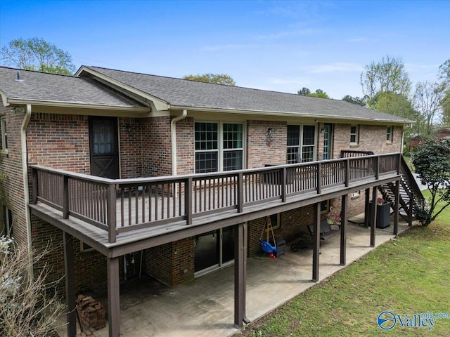 1762 Old Big Cove Rd SE, Owens Cross Roads, AL 35763 - back of house featuring a patio area, brick siding, and a wooden deck