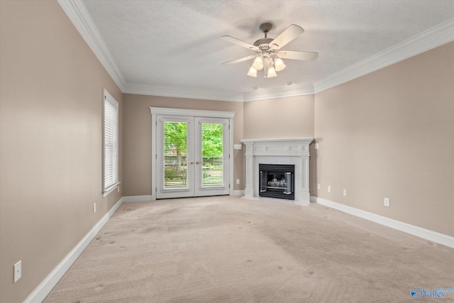 unfurnished living room with carpet floors, baseboards, and a fireplace with flush hearth