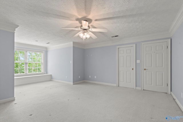 interior space featuring ceiling fan, a textured ceiling, light colored carpet, visible vents, and baseboards