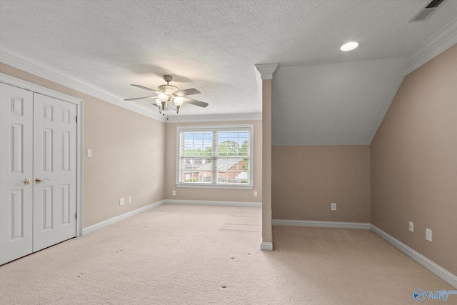 interior space with visible vents, a ceiling fan, carpet, and baseboards