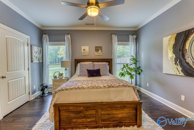 bedroom featuring ceiling fan, crown molding, and dark wood-type flooring