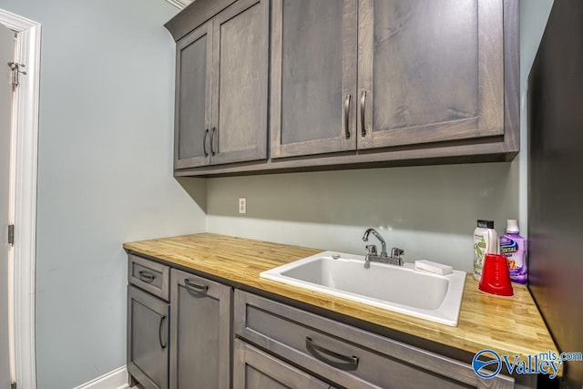 interior space featuring sink and butcher block counters