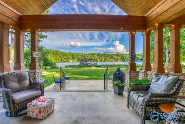 view of patio featuring an outdoor living space and a water view