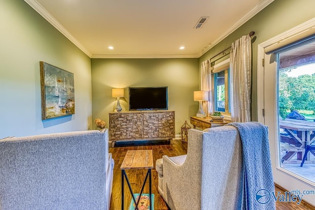 living room featuring hardwood / wood-style floors and ornamental molding