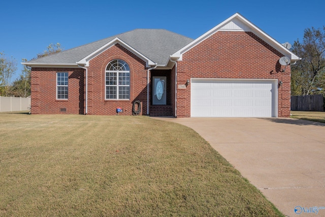 view of front property with a front lawn and a garage