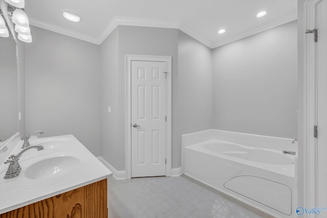 bathroom with vanity, ornamental molding, and a washtub