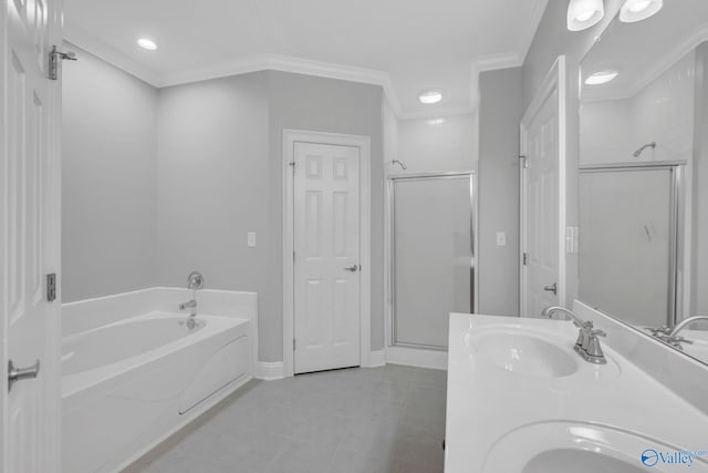 bathroom featuring vanity, independent shower and bath, crown molding, and tile patterned flooring