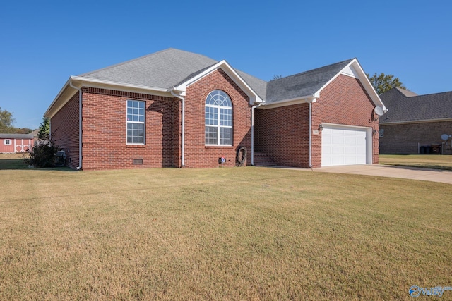 view of front of house featuring a front yard and a garage