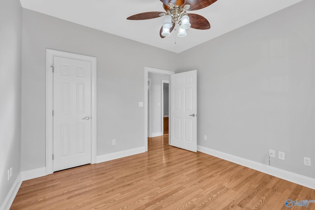 unfurnished bedroom with light hardwood / wood-style floors and ceiling fan