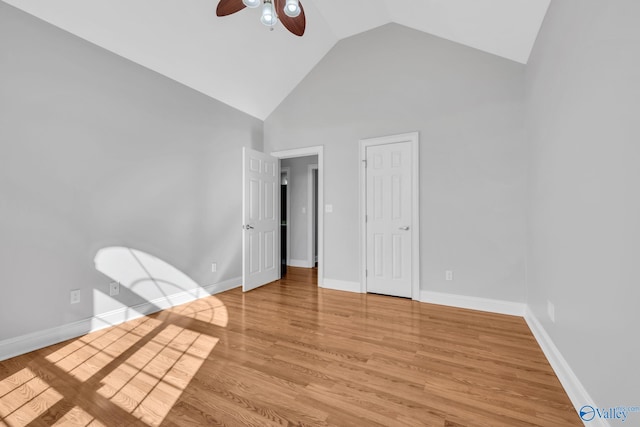 unfurnished bedroom featuring light hardwood / wood-style floors, high vaulted ceiling, and ceiling fan