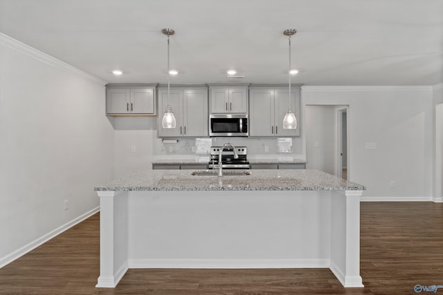 138 Barlow Way, Owens Cross Roads, AL 35763 - kitchen with dark wood-style floors, appliances with stainless steel finishes, ornamental molding, a kitchen island with sink, and a sink