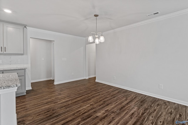 138 Barlow Way, Owens Cross Roads, AL 35763 - unfurnished dining area with ornamental molding, visible vents, baseboards, and dark wood-style floors