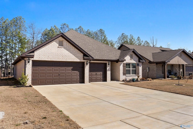 view of front of property featuring a garage, driveway, brick siding, and roof with shingles