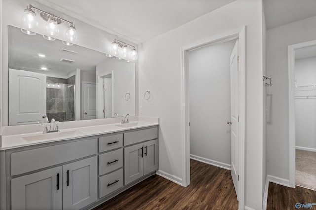 138 Barlow Way, Owens Cross Roads, AL 35763 - full bath with a stall shower, a sink, and wood finished floors