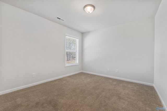 138 Barlow Way, Owens Cross Roads, AL 35763 - empty room with light colored carpet, visible vents, and baseboards