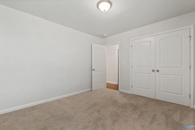 138 Barlow Way, Owens Cross Roads, AL 35763 - unfurnished bedroom featuring carpet floors, baseboards, and a closet