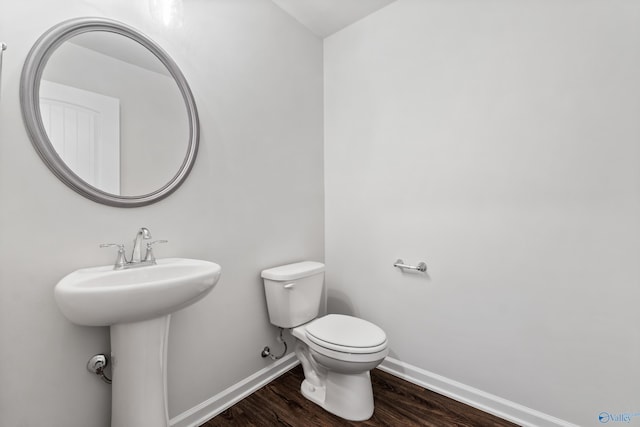 138 Barlow Way, Owens Cross Roads, AL 35763 - half bathroom featuring a sink, wood finished floors, toilet, and baseboards