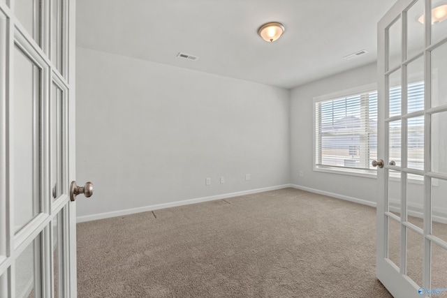 138 Barlow Way, Owens Cross Roads, AL 35763 - carpeted empty room with visible vents, baseboards, and french doors