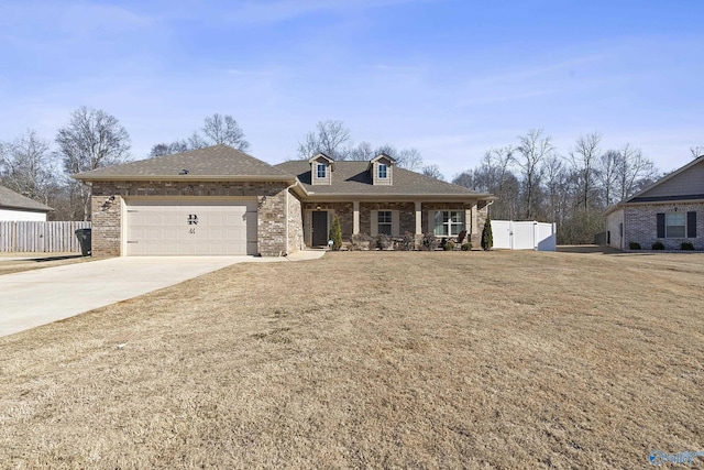 view of front of house with a garage and a front yard