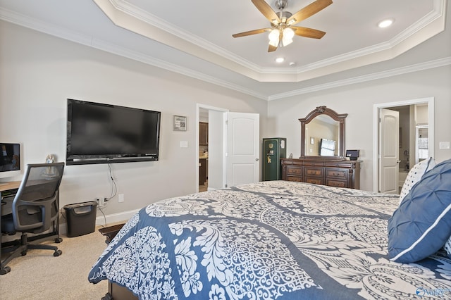 bedroom with ceiling fan, ornamental molding, a raised ceiling, and carpet floors