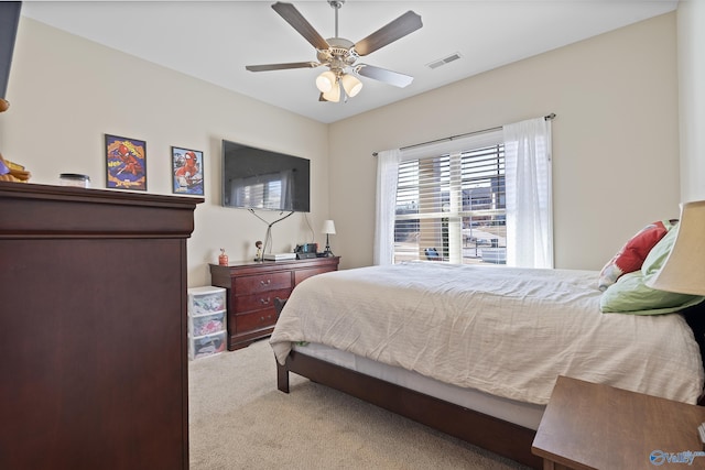 carpeted bedroom featuring ceiling fan