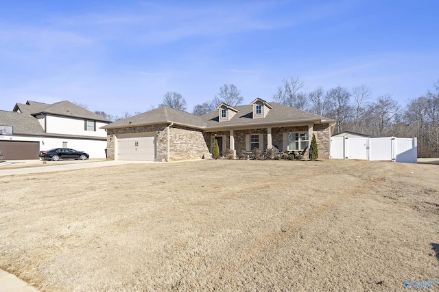 view of front facade with a garage and covered porch